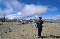 Man standing by prayer flags